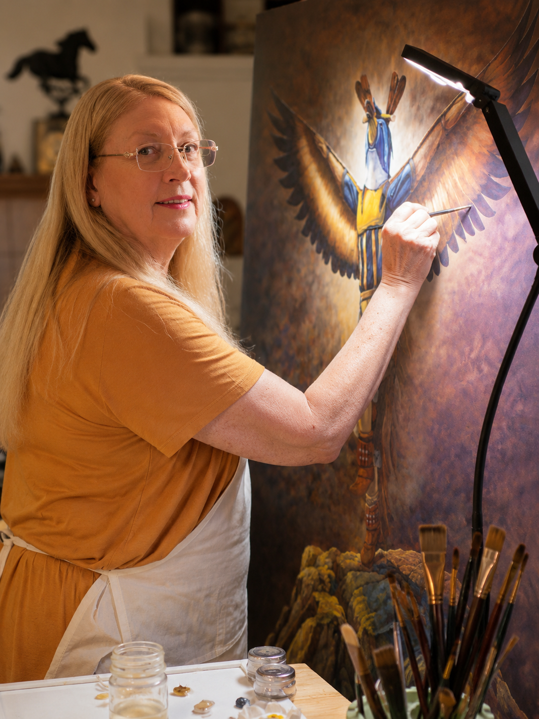 Tonja Hicks painting in her Arizona art studio